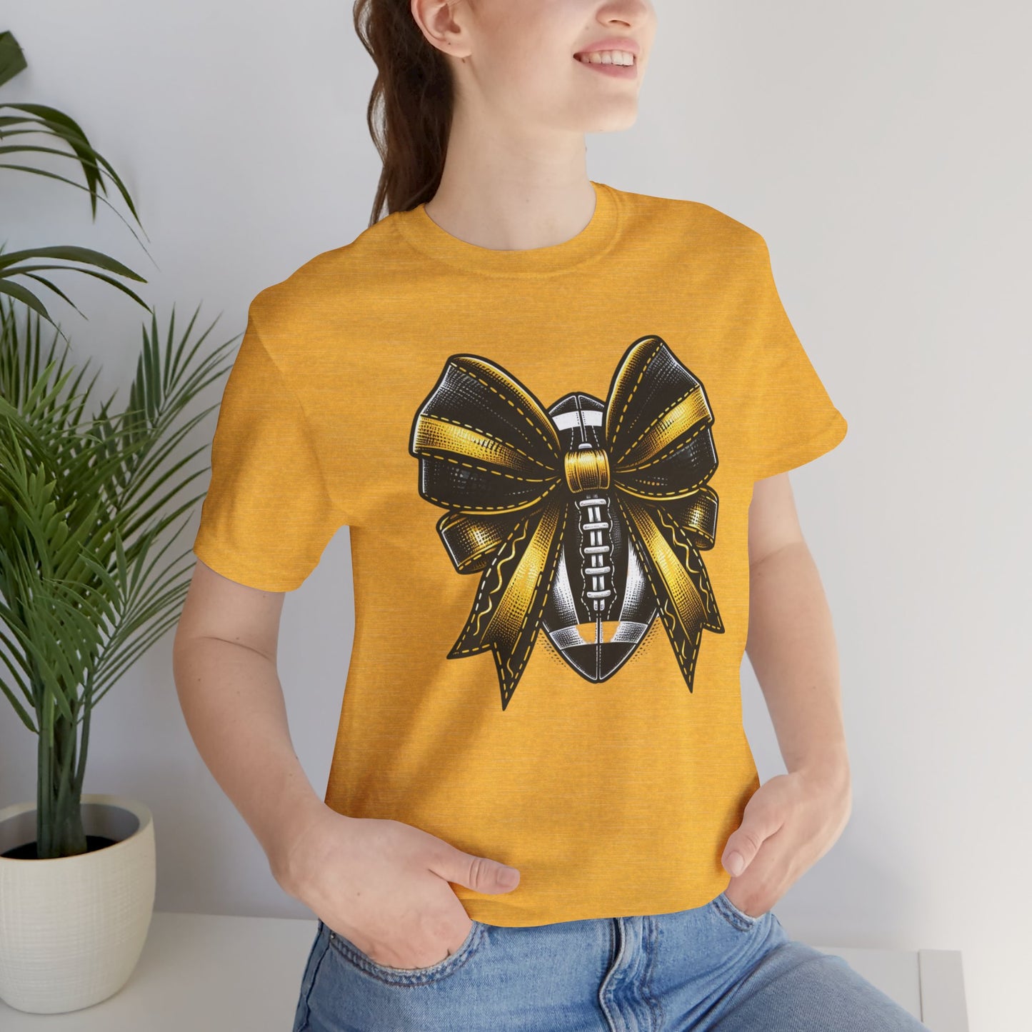 Football Bow Unisex Tee | Sporty Style Tee, Game Day T-Shirt, Casual Wear, Athletic Gift, Fan Apparel, Black and Gold, Saints