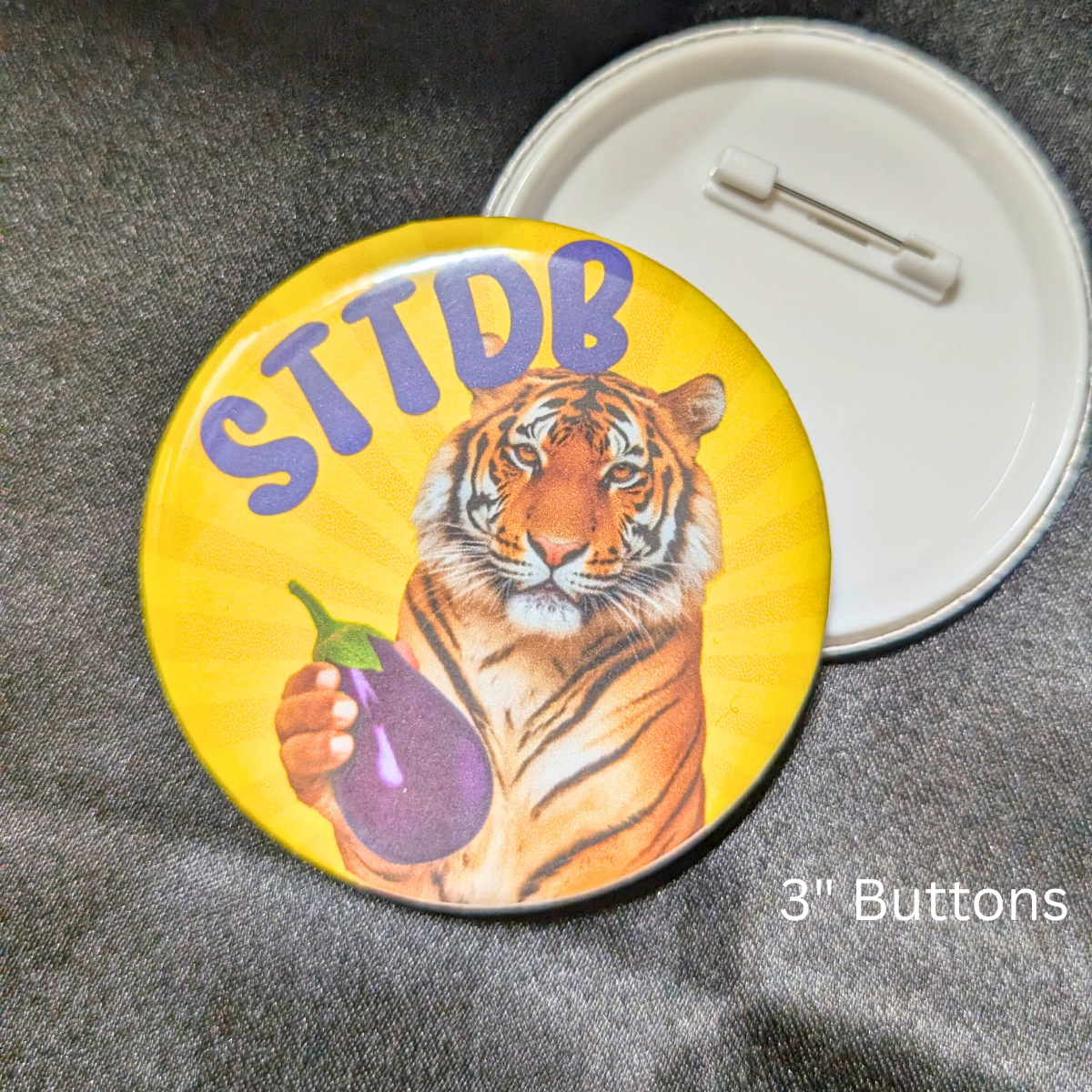 sttdb, with a tiger holding an eggplant, 3" Buttons, Pin