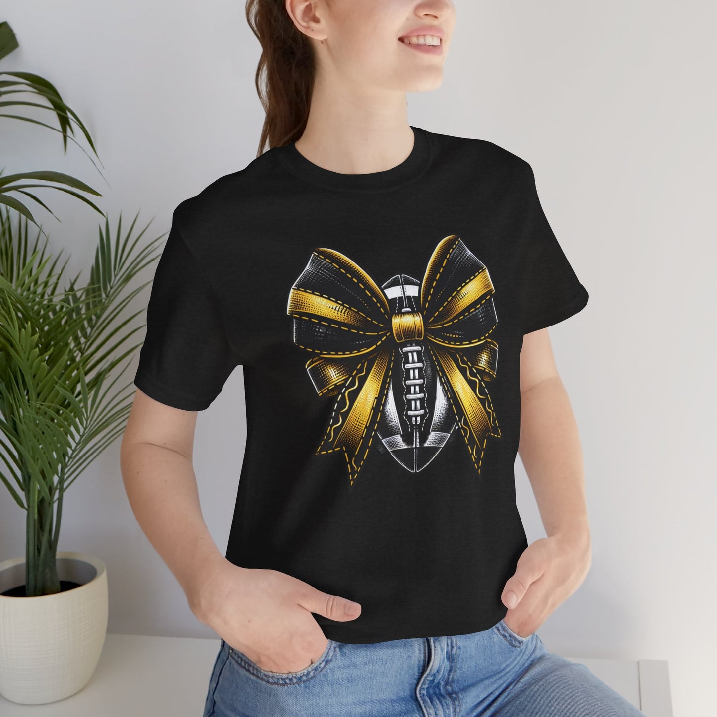 Football Bow Unisex Tee | Sporty Style Tee, Game Day T-Shirt, Casual Wear, Athletic Gift, Fan Apparel, Black and Gold, Saints