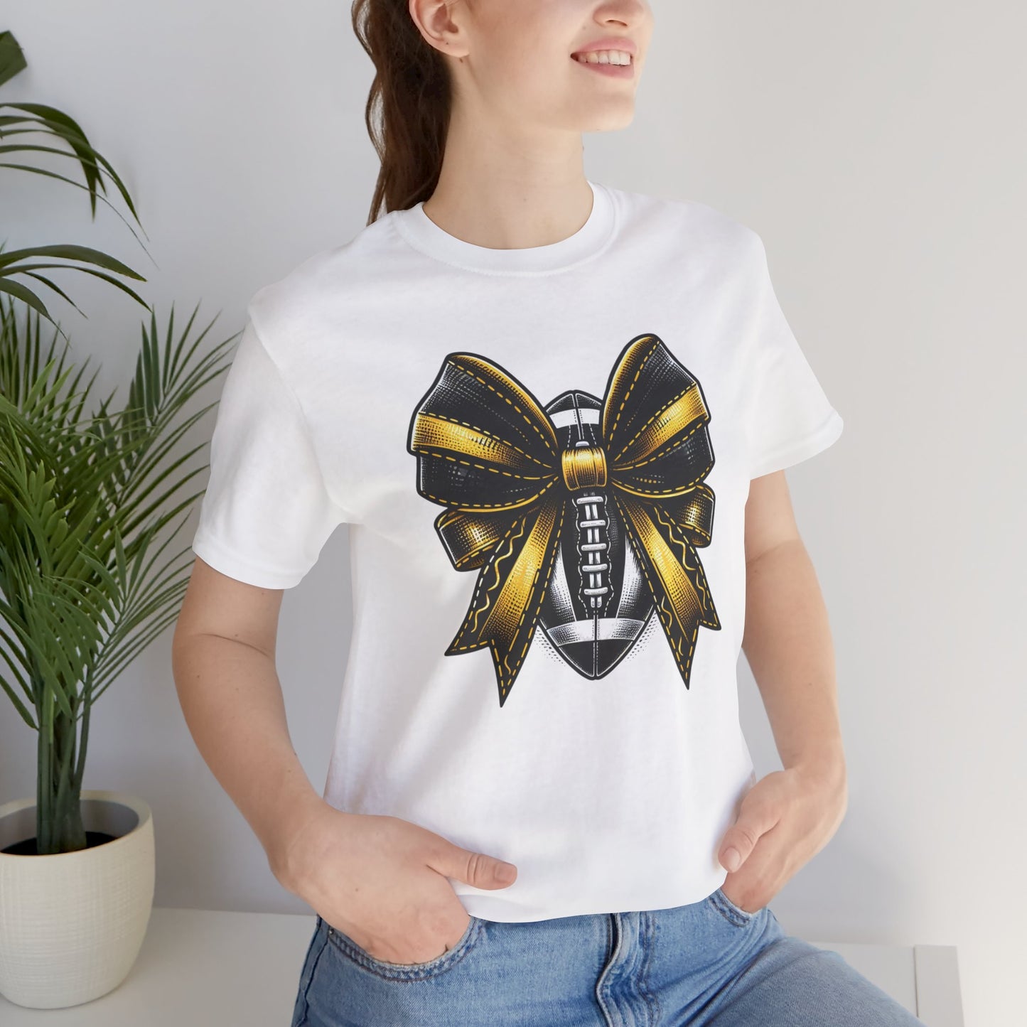 Football Bow Unisex Tee | Sporty Style Tee, Game Day T-Shirt, Casual Wear, Athletic Gift, Fan Apparel, Black and Gold, Saints
