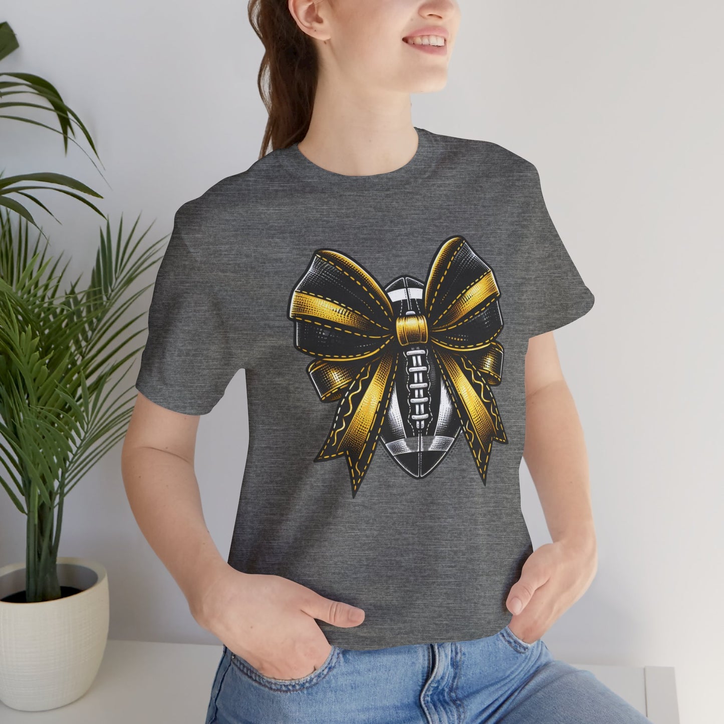 Football Bow Unisex Tee | Sporty Style Tee, Game Day T-Shirt, Casual Wear, Athletic Gift, Fan Apparel, Black and Gold, Saints