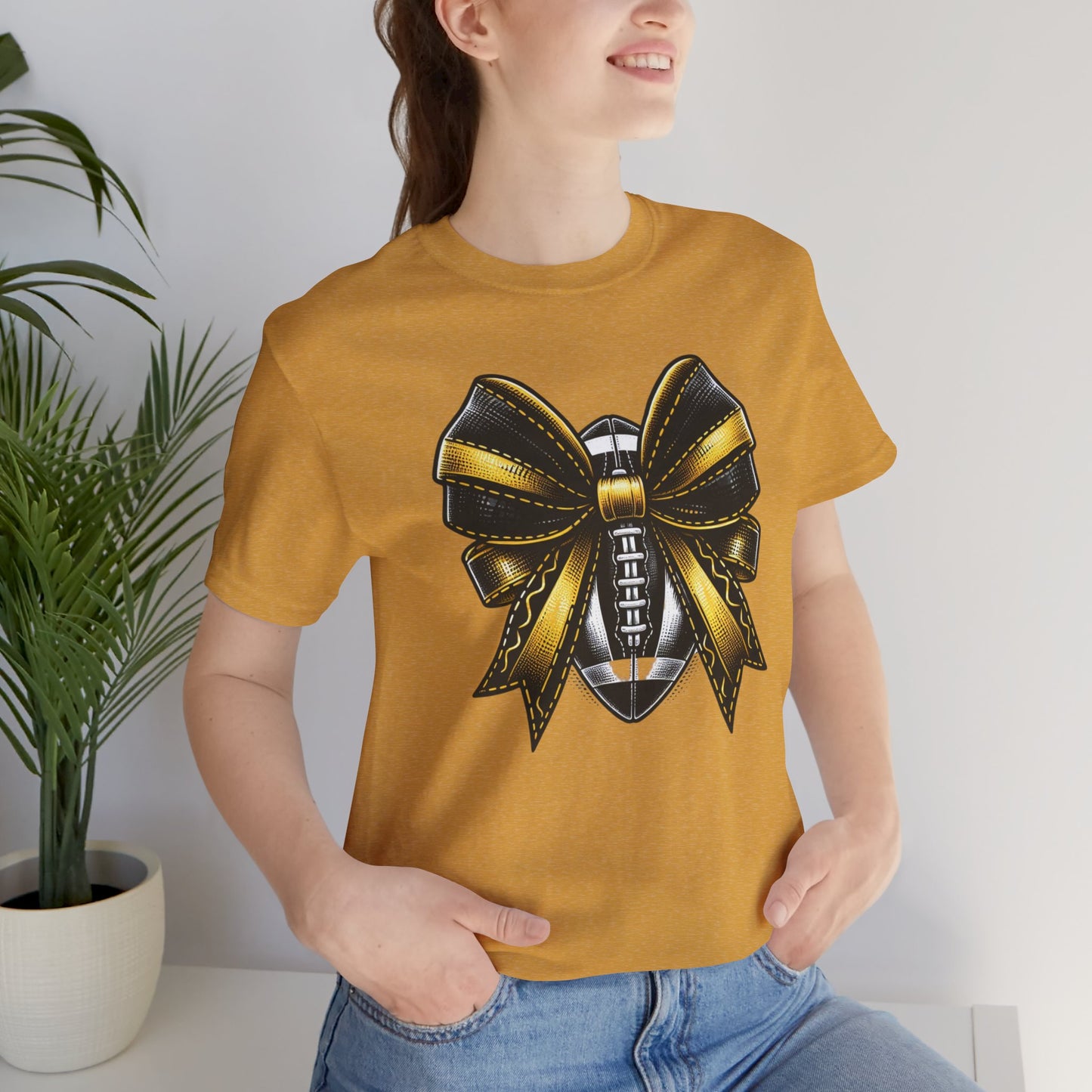Football Bow Unisex Tee | Sporty Style Tee, Game Day T-Shirt, Casual Wear, Athletic Gift, Fan Apparel, Black and Gold, Saints