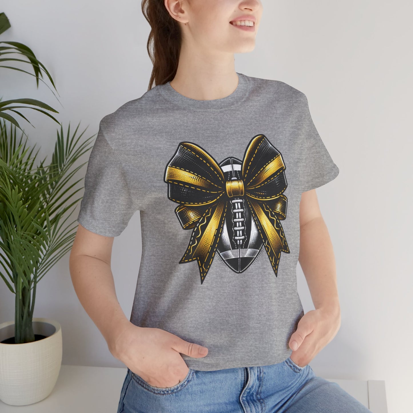 Football Bow Unisex Tee | Sporty Style Tee, Game Day T-Shirt, Casual Wear, Athletic Gift, Fan Apparel, Black and Gold, Saints