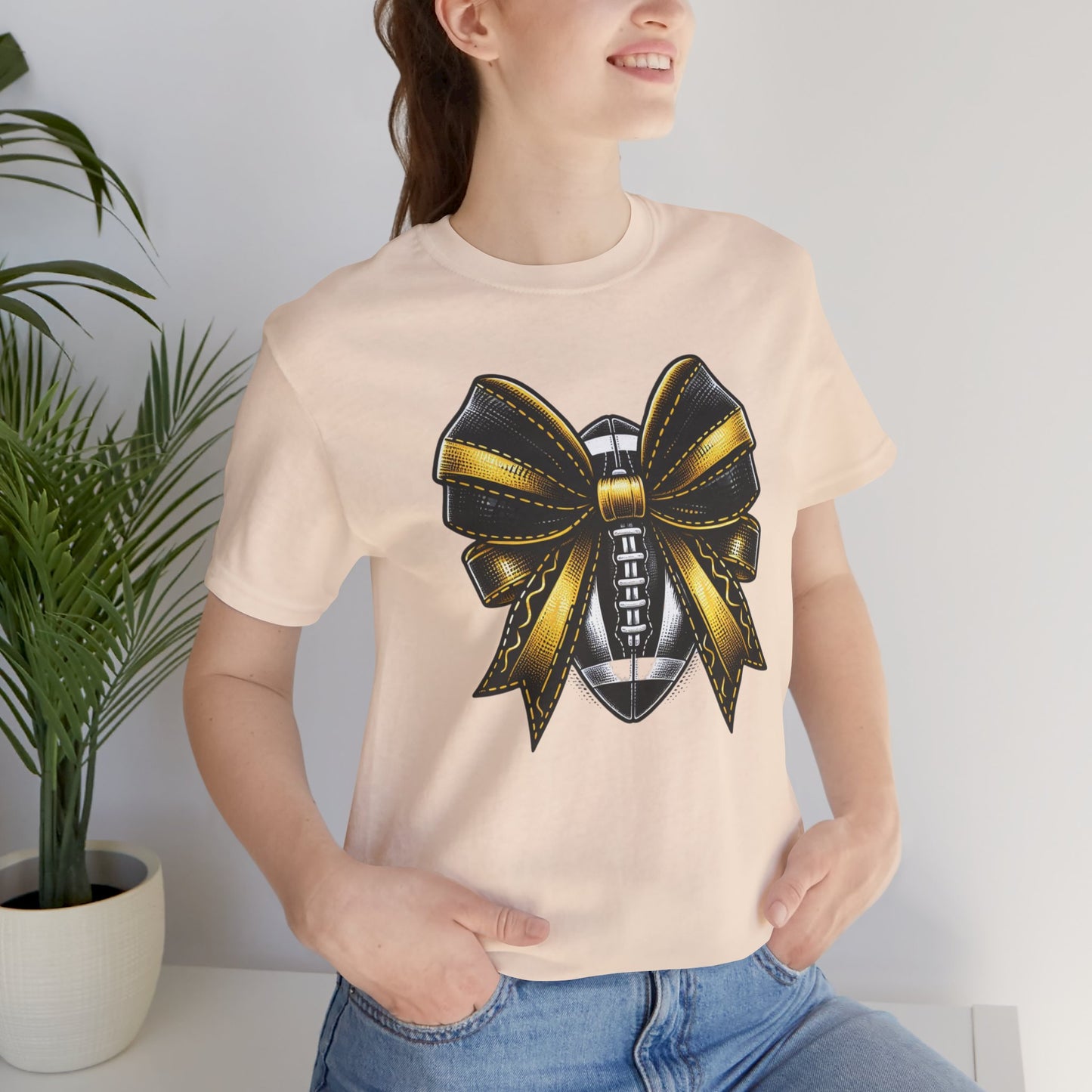 Football Bow Unisex Tee | Sporty Style Tee, Game Day T-Shirt, Casual Wear, Athletic Gift, Fan Apparel, Black and Gold, Saints